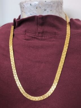 Textured Gold Herringbone Necklace on Maroon Top